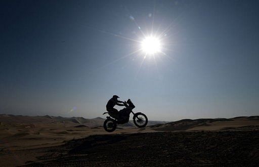 Alain Duclos jumps during Stage 3 of the Dakar Rally 2013 between Pisco and Nazca, Peru, on January 7, 2013